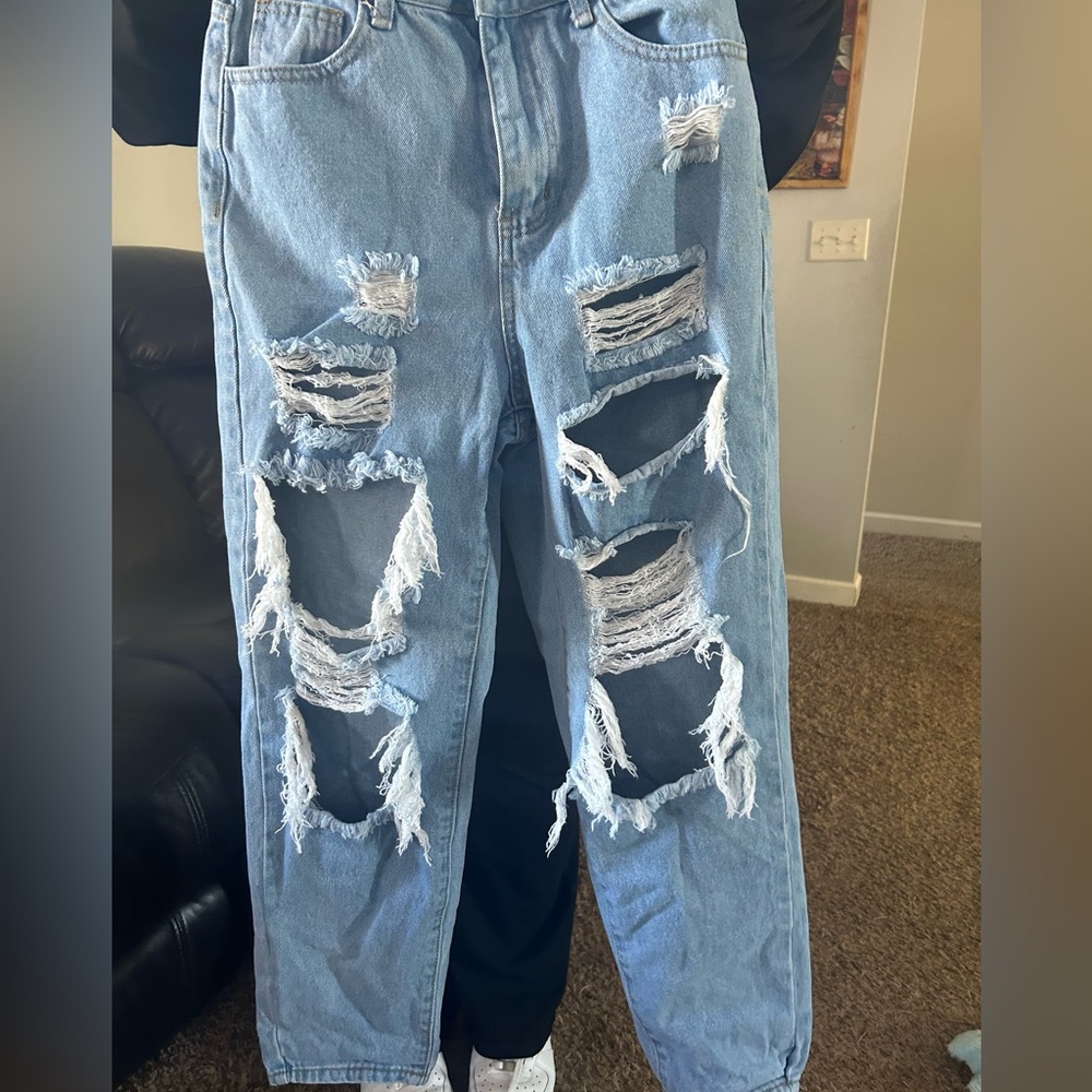 Ripped blue SHEIN jeans.